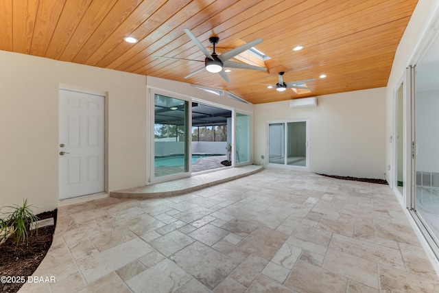 view of patio / terrace with ceiling fan and a wall mounted AC