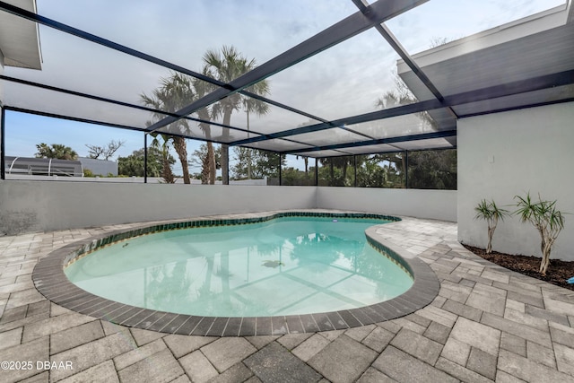 view of pool featuring a patio area and a lanai