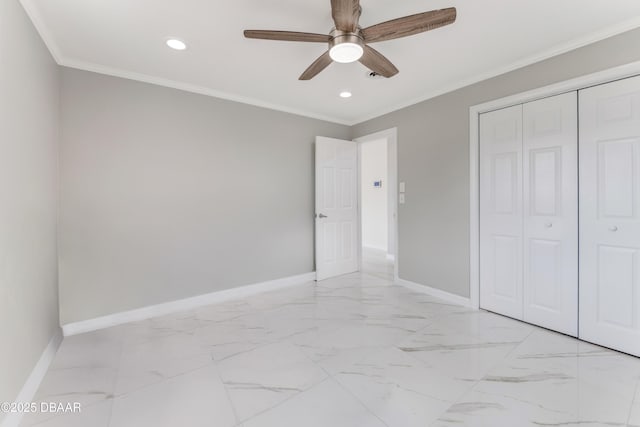 unfurnished bedroom with ceiling fan, a closet, and crown molding