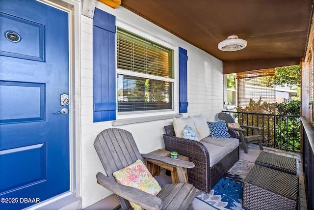 wooden terrace featuring covered porch