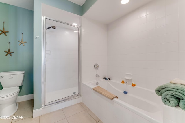 bathroom with toilet, plus walk in shower, and tile patterned flooring