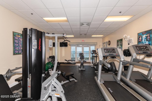 exercise room with a drop ceiling