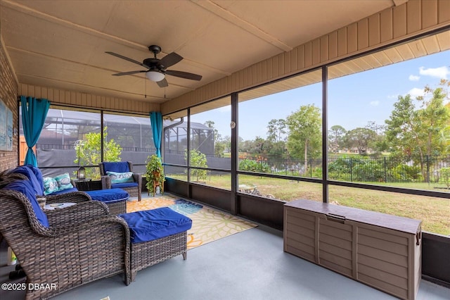 sunroom featuring ceiling fan