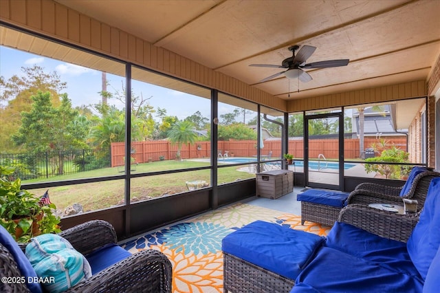 sunroom with ceiling fan and a healthy amount of sunlight