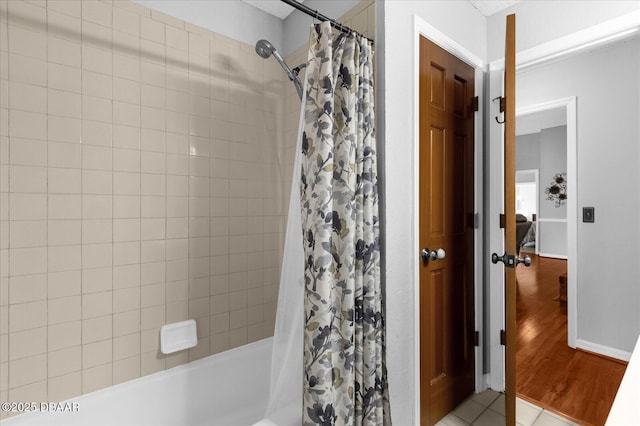 bathroom featuring tile patterned floors and shower / bath combo