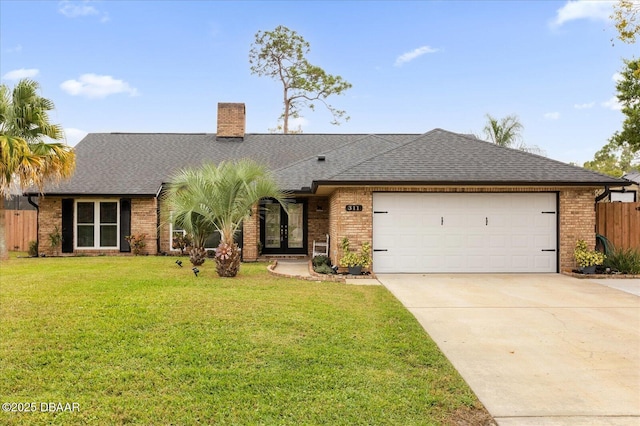 ranch-style home with a garage and a front yard