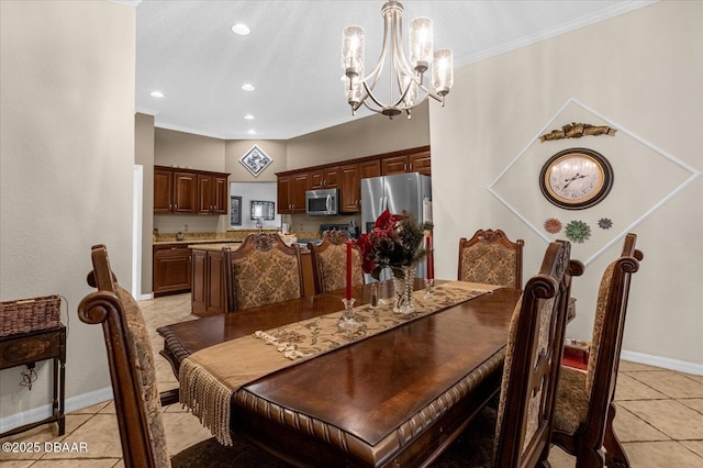 tiled dining area featuring crown molding and a notable chandelier