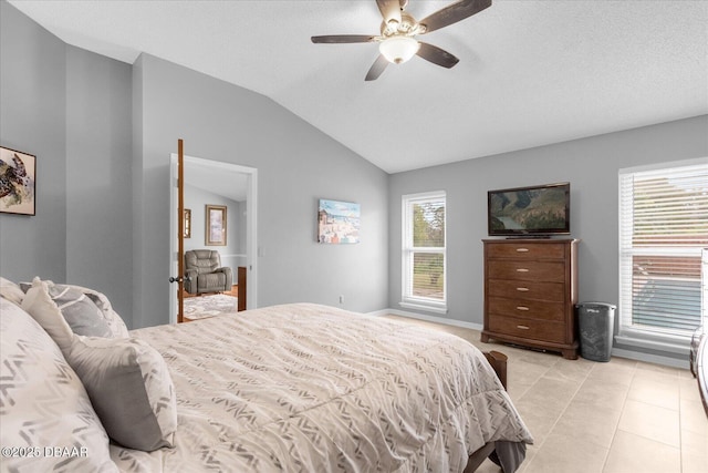 bedroom with vaulted ceiling, ceiling fan, and multiple windows