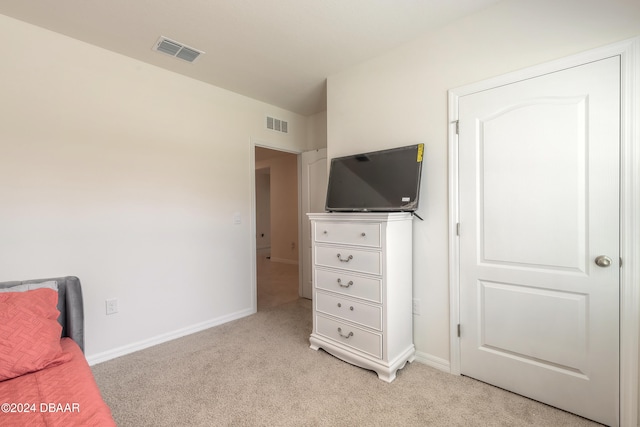 living area with light carpet