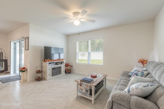 tiled living room with ceiling fan