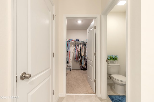 bathroom with tile patterned flooring and toilet