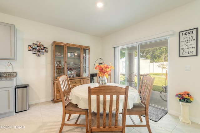 dining space with light tile patterned flooring