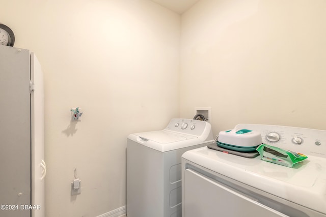 laundry room featuring washing machine and dryer