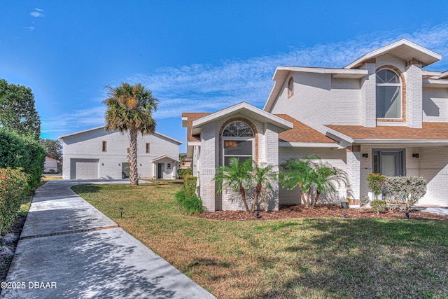 view of front of property featuring a garage and a front yard