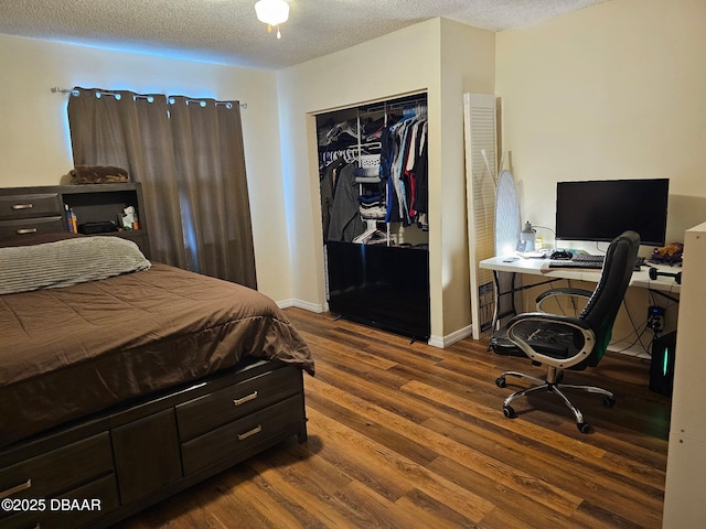 2519 Eustace Ave, Deltona, FL 32725 - bedroom with wood finished floors, a closet, a textured ceiling, a desk, and baseboards