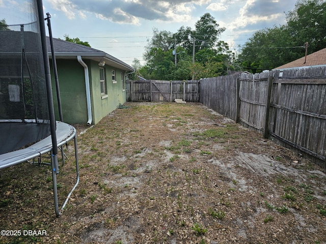 2519 Eustace Ave, Deltona, FL 32725 - fenced backyard featuring a trampoline