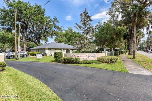 203 S Orchard St Unit 5C, Ormond Beach, FL 32174 - community sign with a yard and driveway