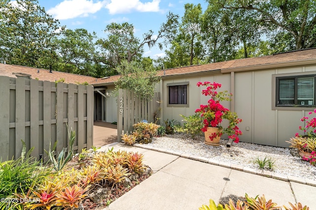 view of exterior entry with fence