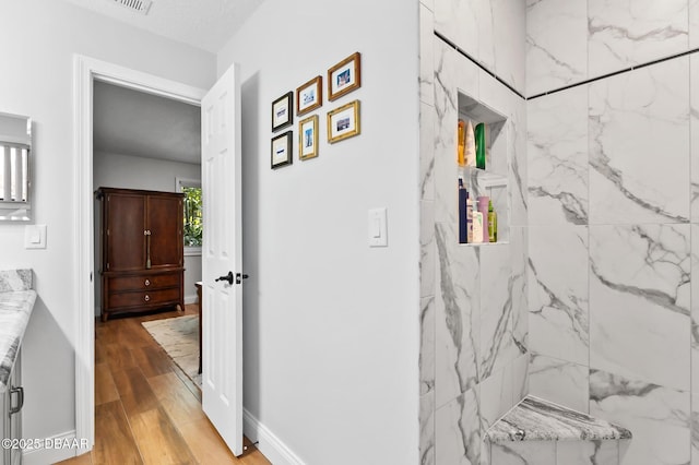 hallway featuring wood finished floors