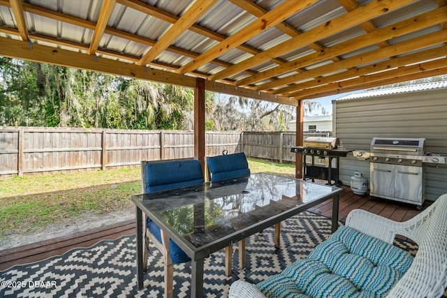 wooden terrace with a grill