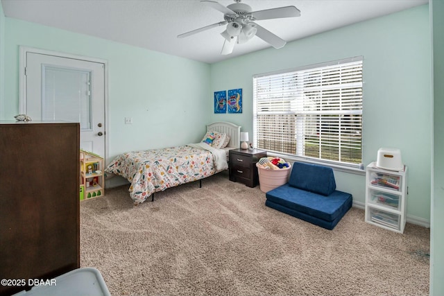 carpeted bedroom featuring ceiling fan