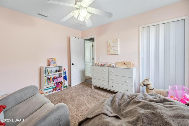 carpeted bedroom with ceiling fan