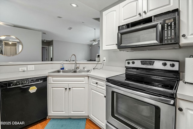 kitchen featuring black appliances, white cabinetry, sink, ceiling fan, and light hardwood / wood-style flooring