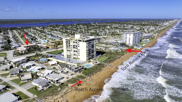 aerial view with a water view and a view of the beach