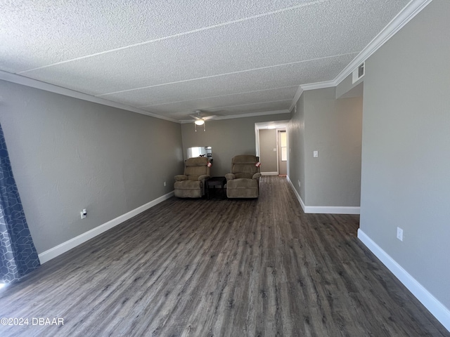 unfurnished room with a textured ceiling, ceiling fan, crown molding, and dark wood-type flooring