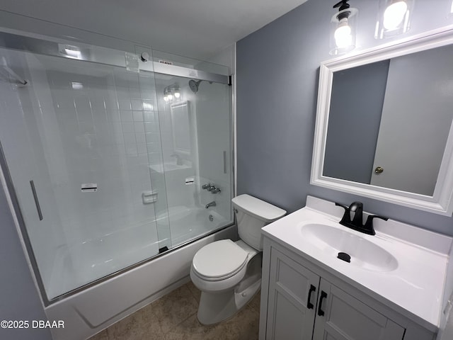 full bathroom with vanity, bath / shower combo with glass door, and toilet