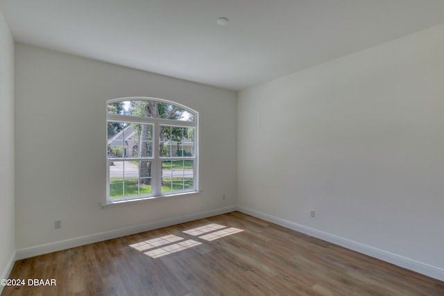 unfurnished room with light hardwood / wood-style flooring