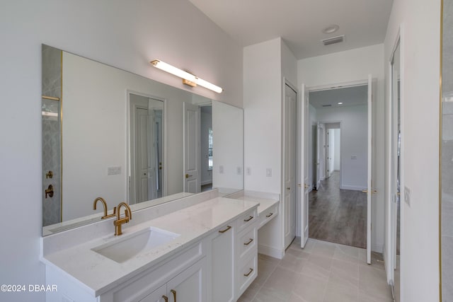 bathroom featuring vanity and hardwood / wood-style flooring