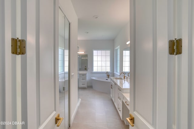 bathroom with vanity, tile patterned floors, and separate shower and tub