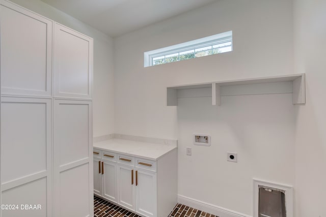 laundry area featuring cabinets, washer hookup, and electric dryer hookup