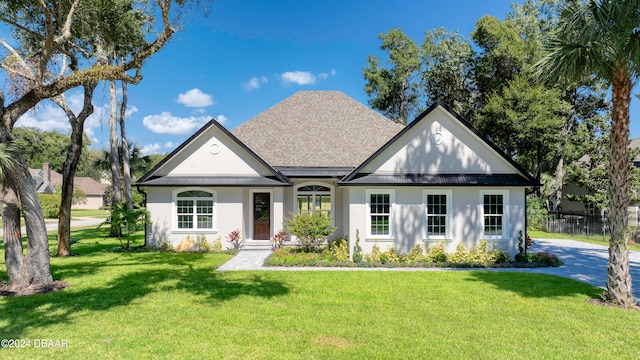 view of front of home with a front lawn