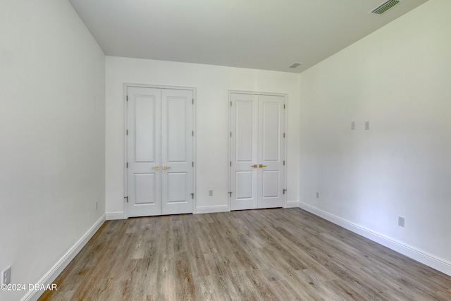 unfurnished bedroom featuring light hardwood / wood-style floors