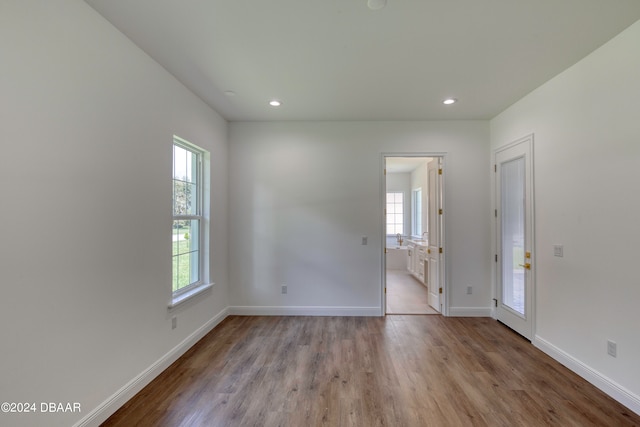 spare room featuring light hardwood / wood-style flooring