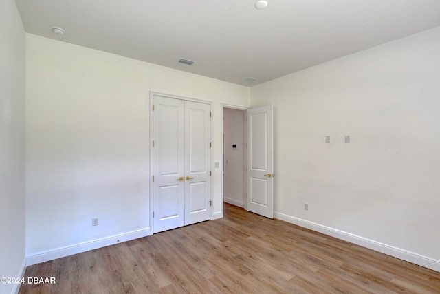 unfurnished bedroom featuring light hardwood / wood-style floors