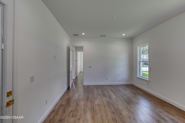 spare room featuring light hardwood / wood-style flooring