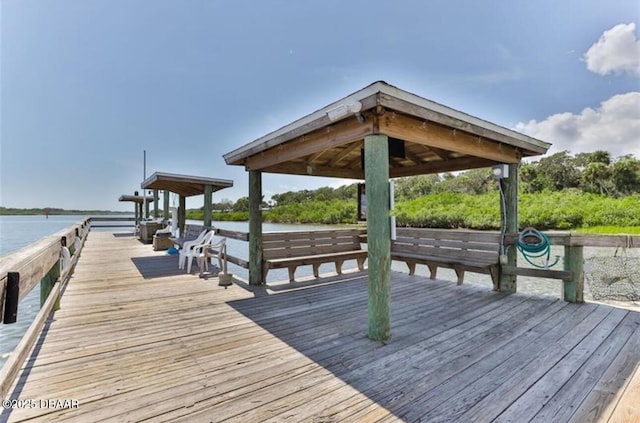 view of dock with a water view and a gazebo