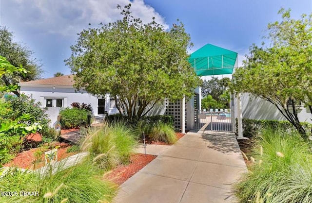 view of property's community with a gate