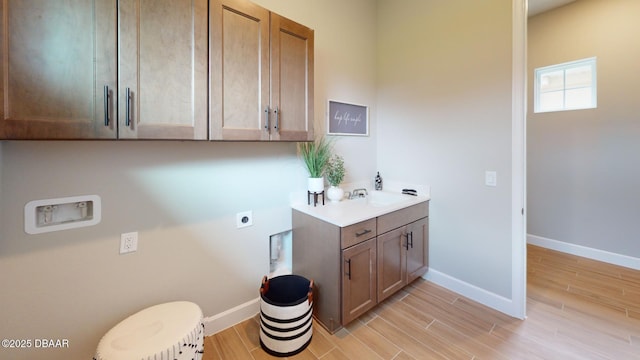 191 Aspen Way, Palm Coast, FL 32137 - laundry room featuring hookup for an electric dryer, washer hookup, and light wood-style flooring