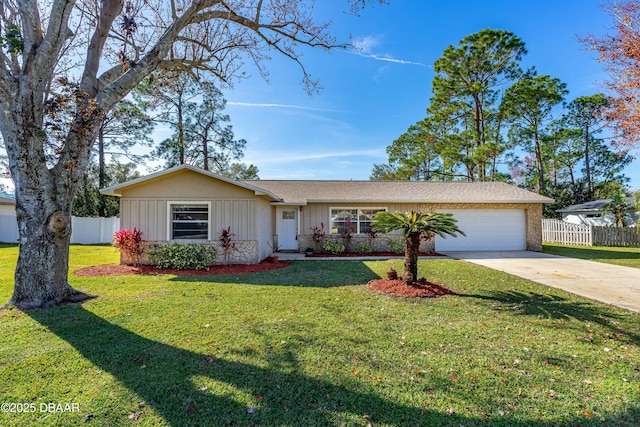 ranch-style home featuring a garage and a front yard