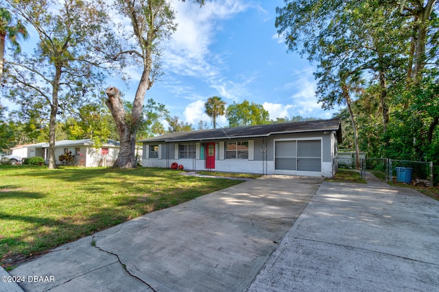 single story home with a porch, a garage, and a front lawn