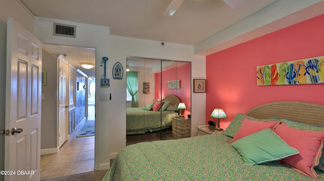 bedroom featuring a closet and tile patterned floors