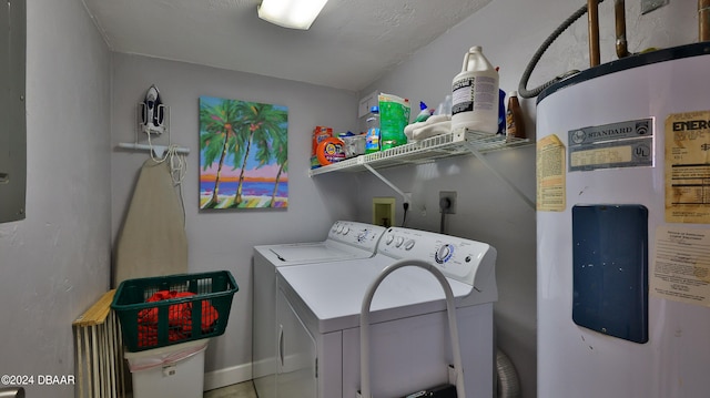 washroom featuring washing machine and dryer and electric water heater