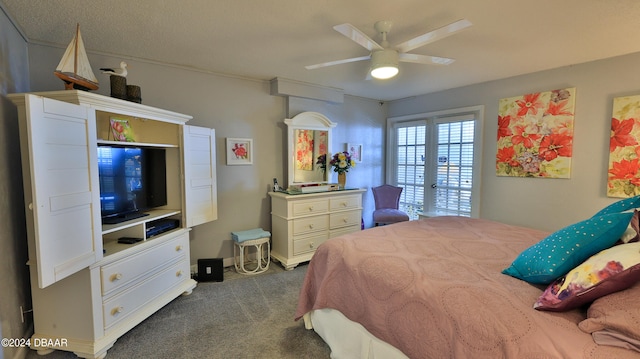 bedroom with dark colored carpet and ceiling fan