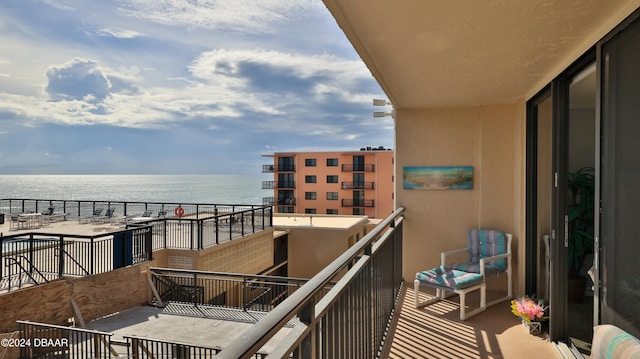 balcony featuring a water view