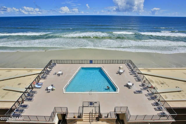 birds eye view of property featuring a view of the beach and a water view