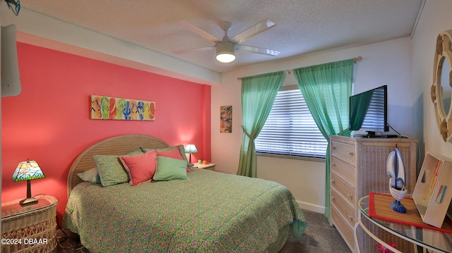 bedroom featuring ceiling fan, a textured ceiling, and carpet floors